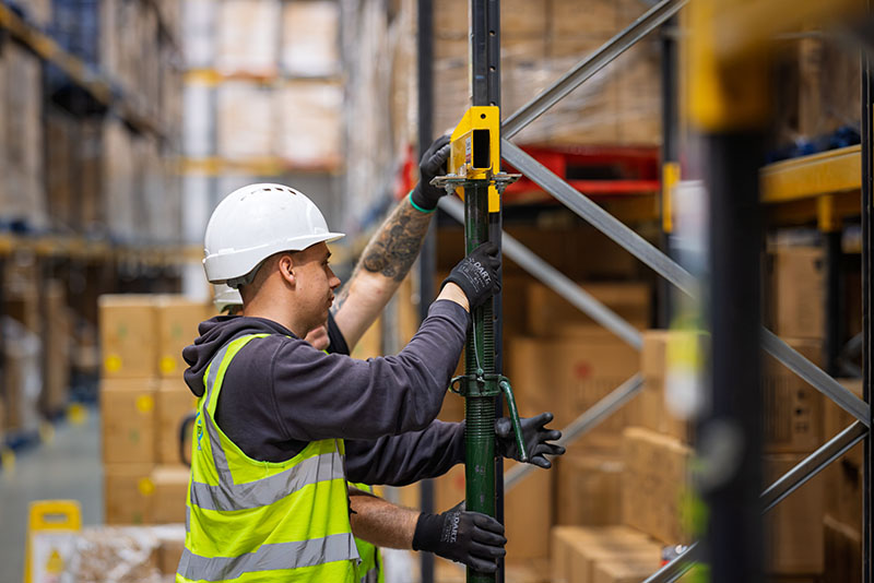 Two men installing Goliath