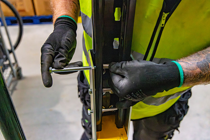 Close up of a man installing Goliath