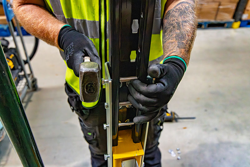 Close up of a man installing Goliath